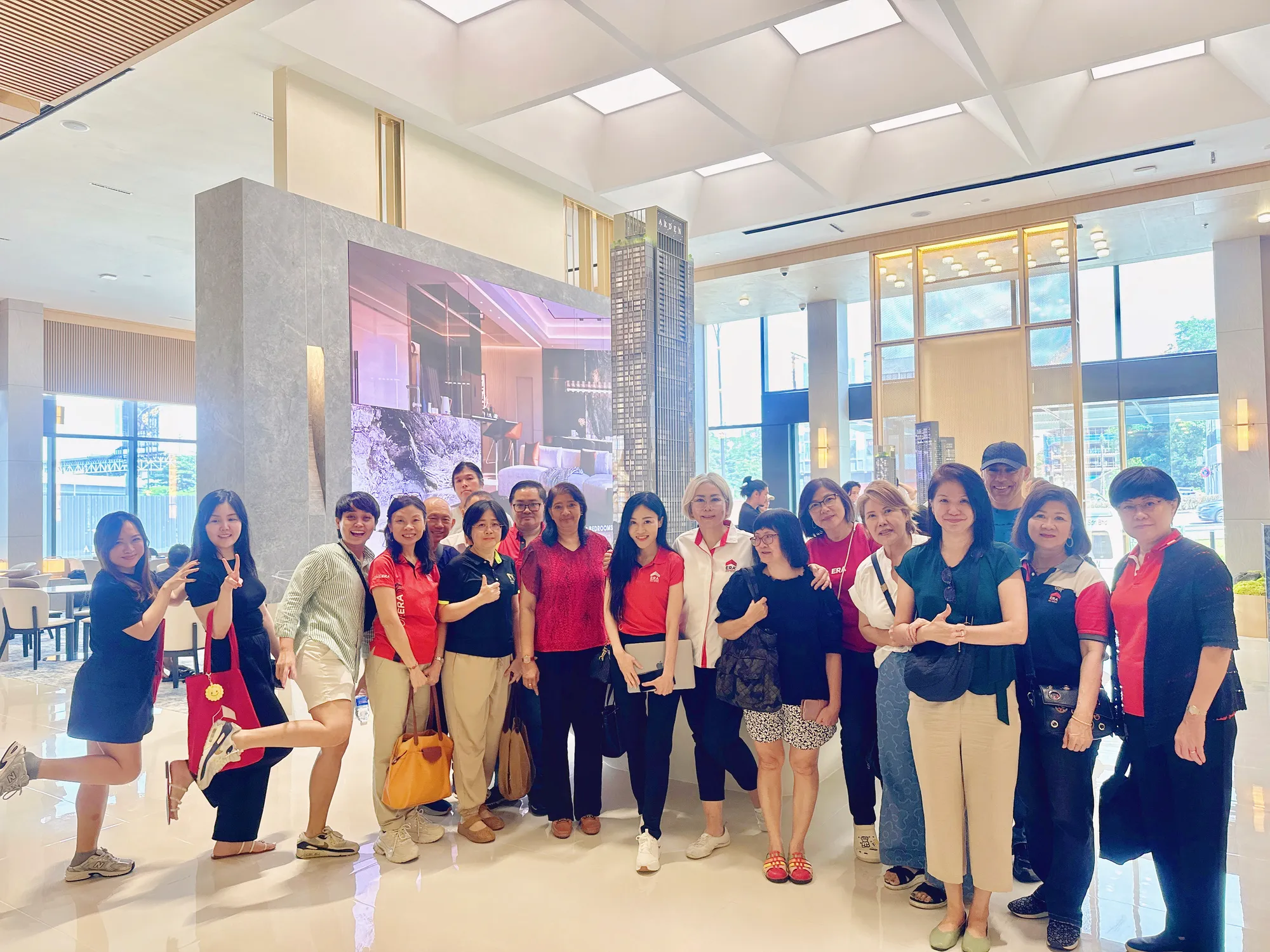 Eve Ang leading a client tour at a developer sales gallery in Johor Bahru