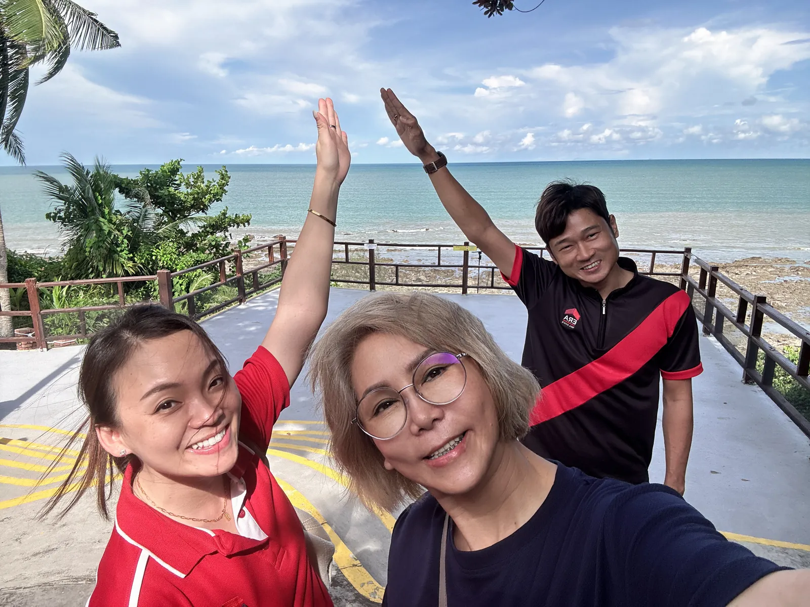 Eve Ang’s team celebrating by the sea on a team retreat