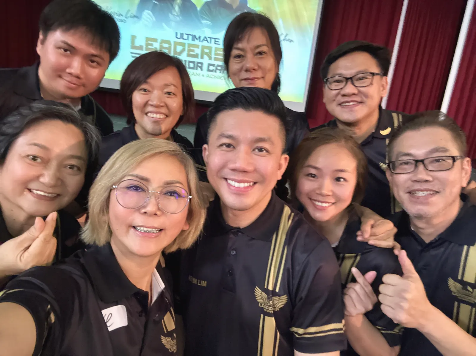Eve Ang's team taking a group selfie at a leadership camp