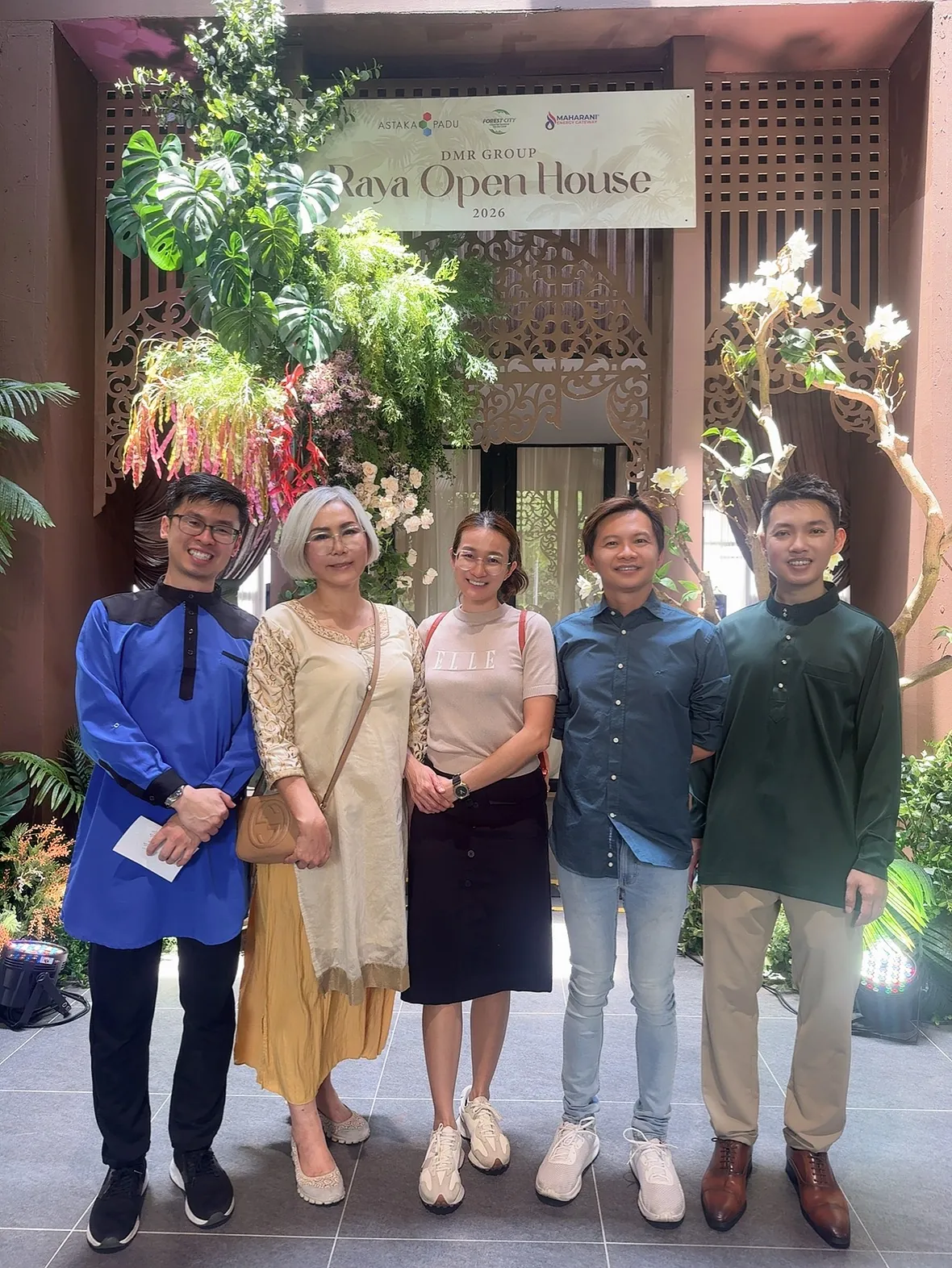 Eve Ang’s team at a Raya open house event
