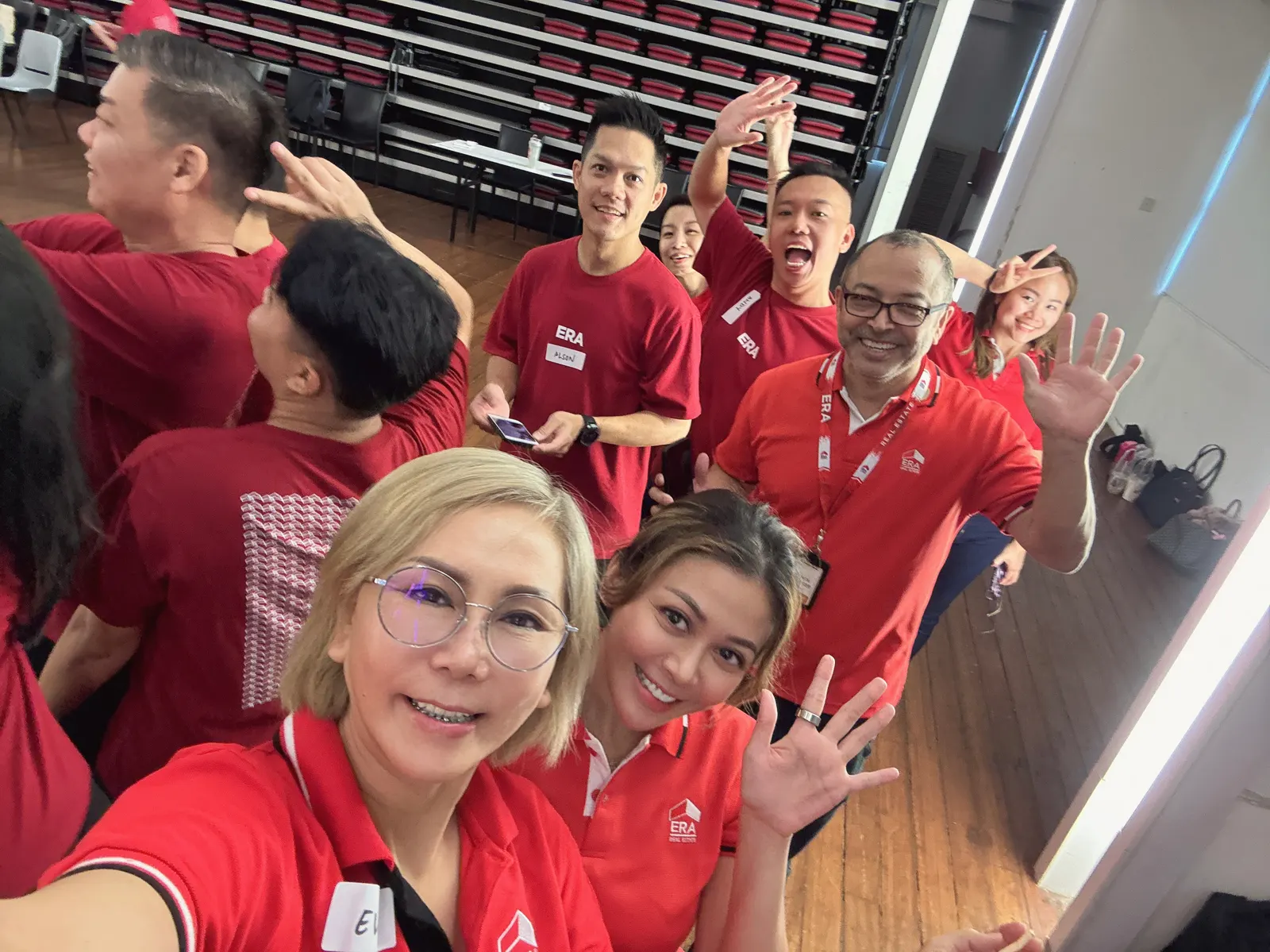 Eve Ang's ERA Malaysia team in red team shirts at a training day