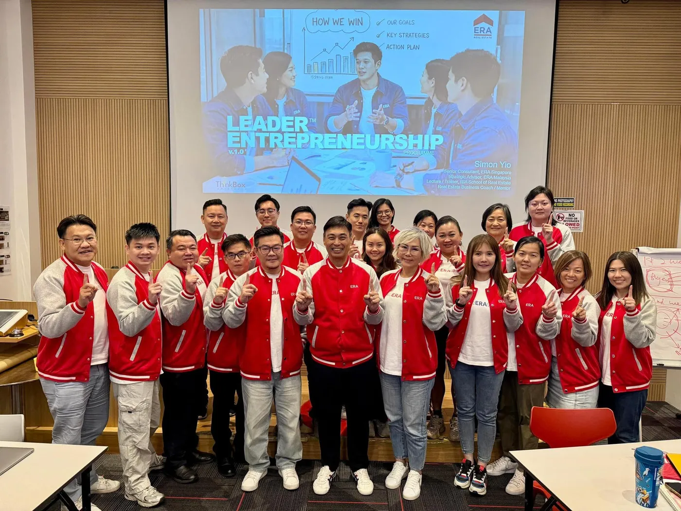 ERA Malaysia agents in team jackets during a strategy training session